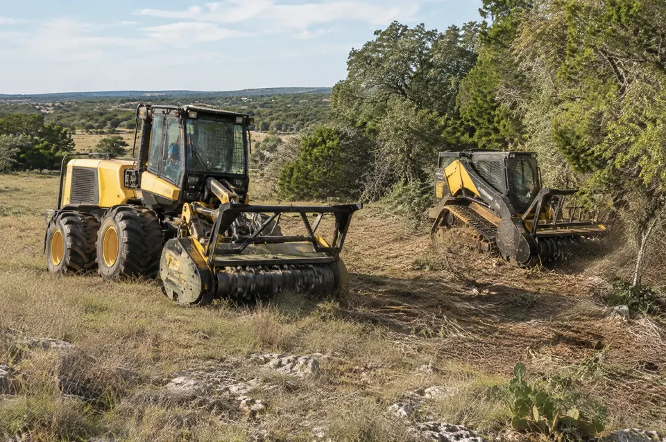Forestry mulching near me: articulated wheeled forestry mulcher and a compact track mulcher on the same job