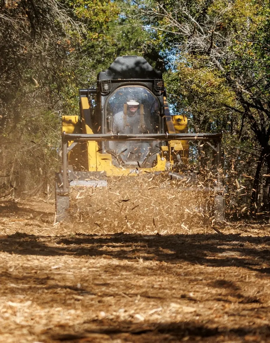 Forestry mulcher head-on, cutting a survey line