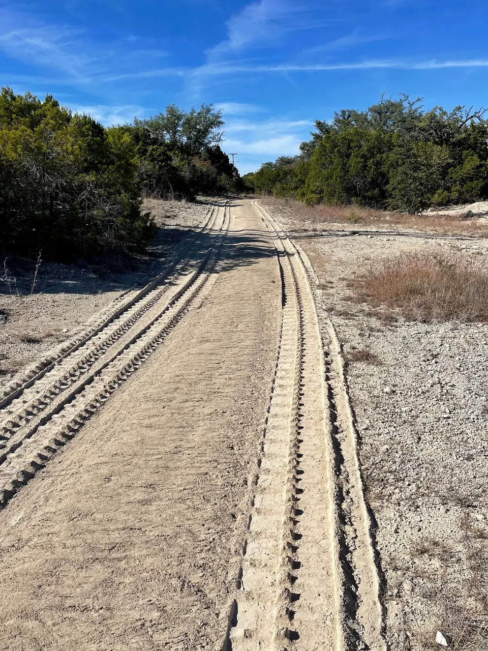 Fresh road base with track marks along a new road