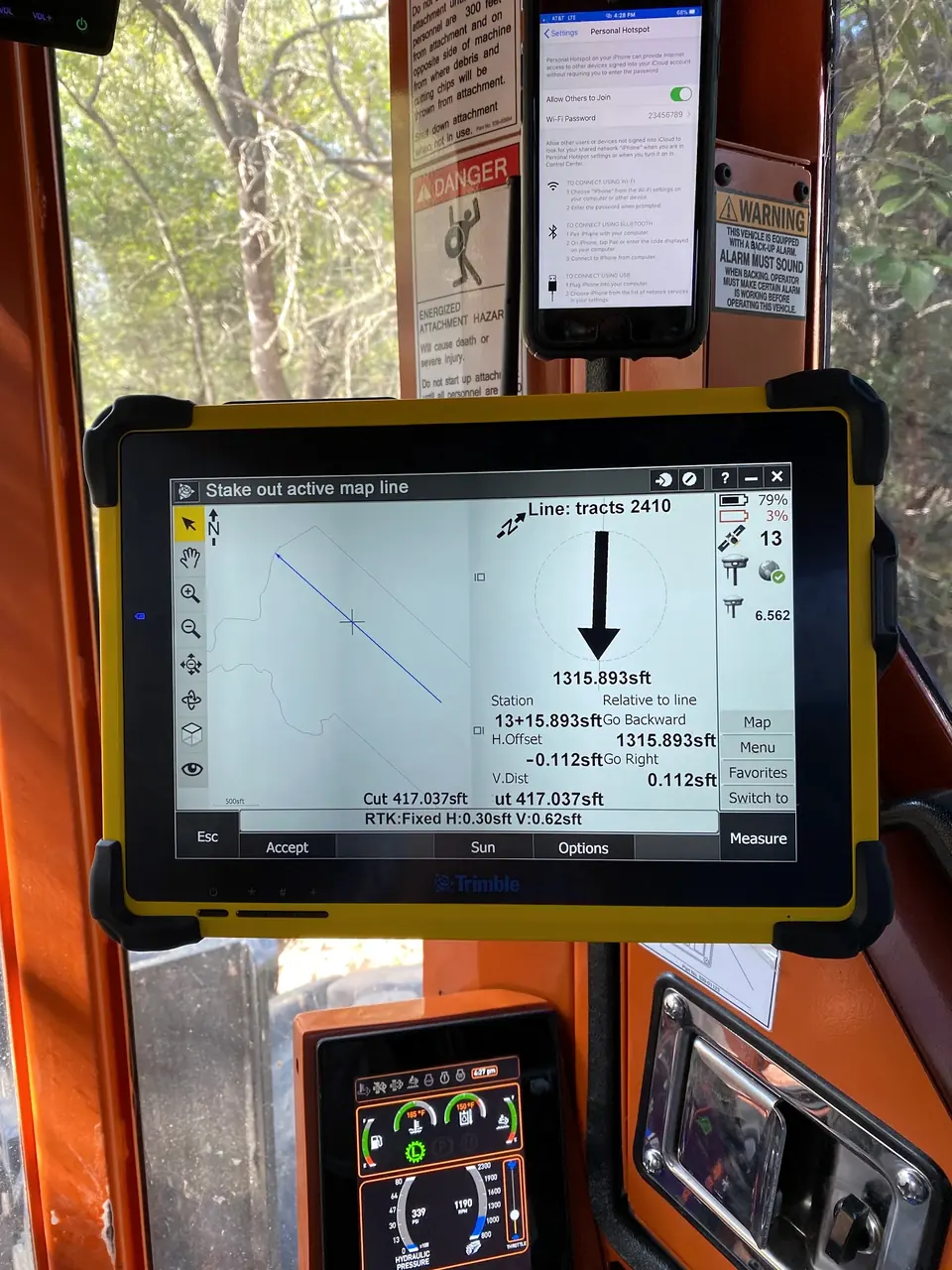 GPS tablet in the cab guiding survey line clearing