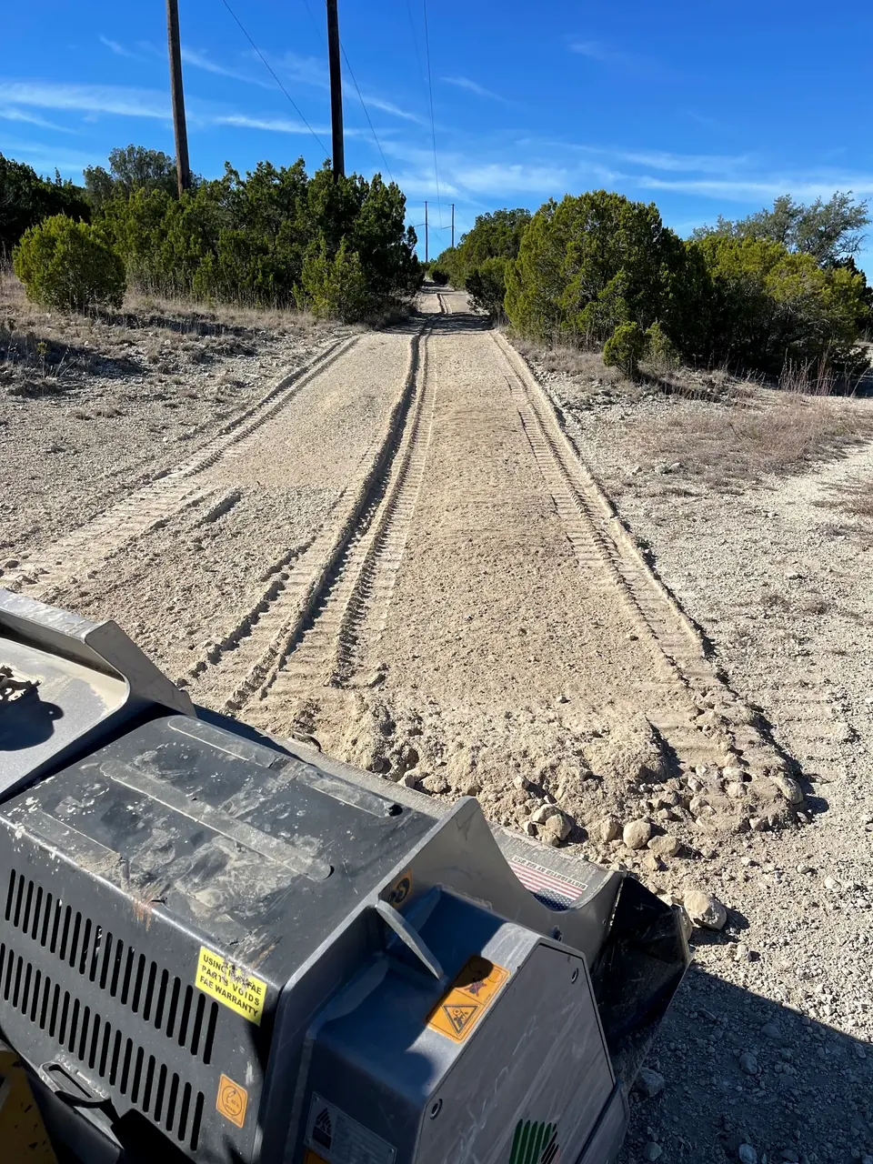 Graded access road with fresh track marks