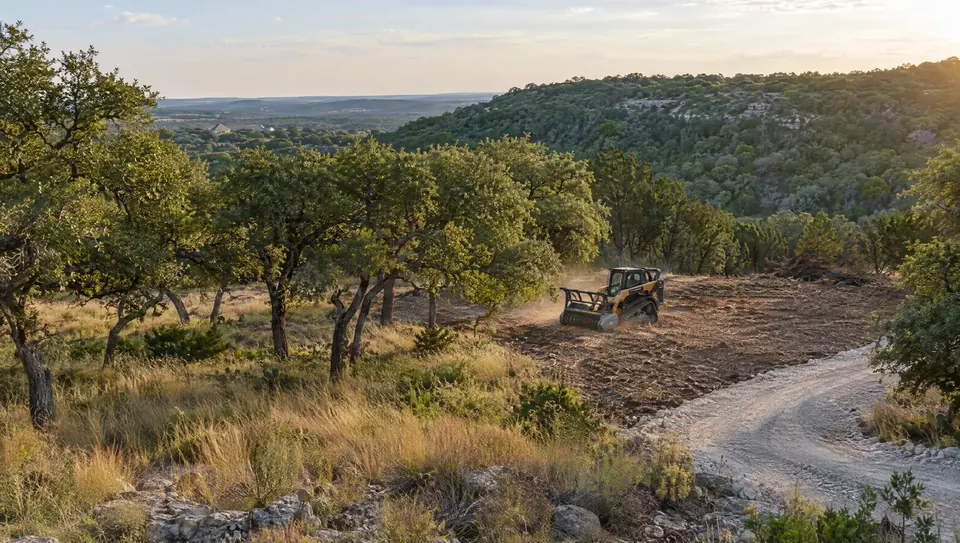 Land clearing in Bulverde, TX: Bulverde valley homesite with live oak clusters, a cleared area and a new driveway