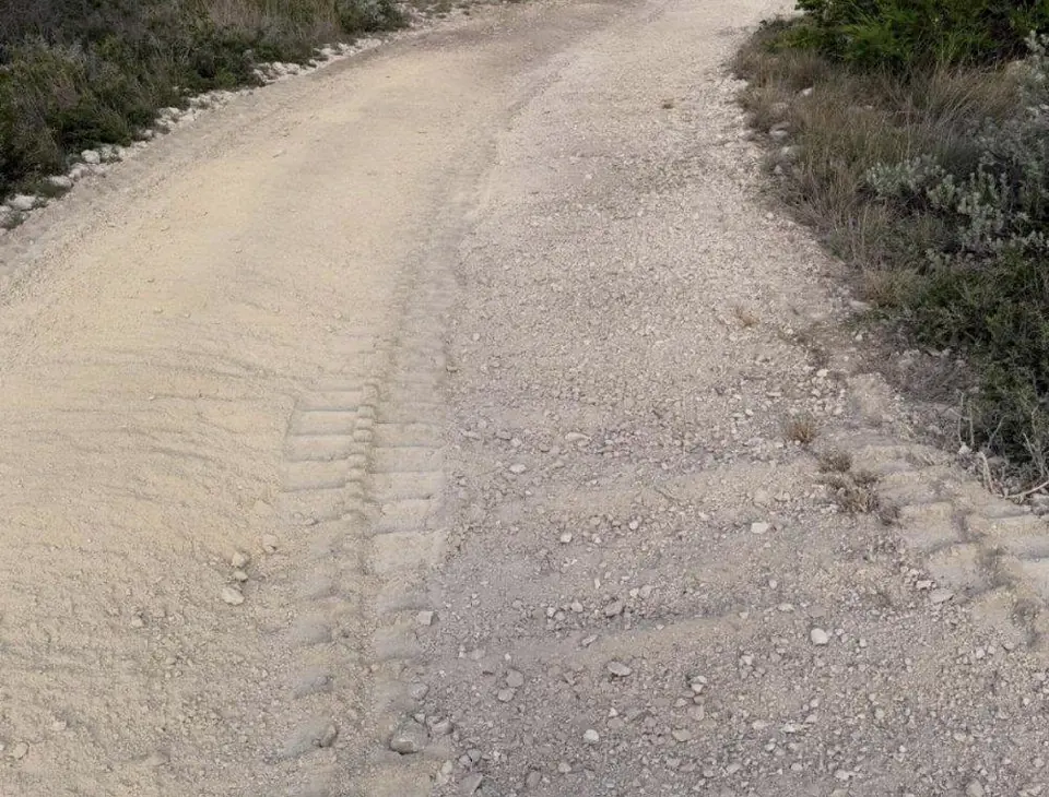Rock crushing for roads: road surface built from rock crushed on site by 9 Arrow