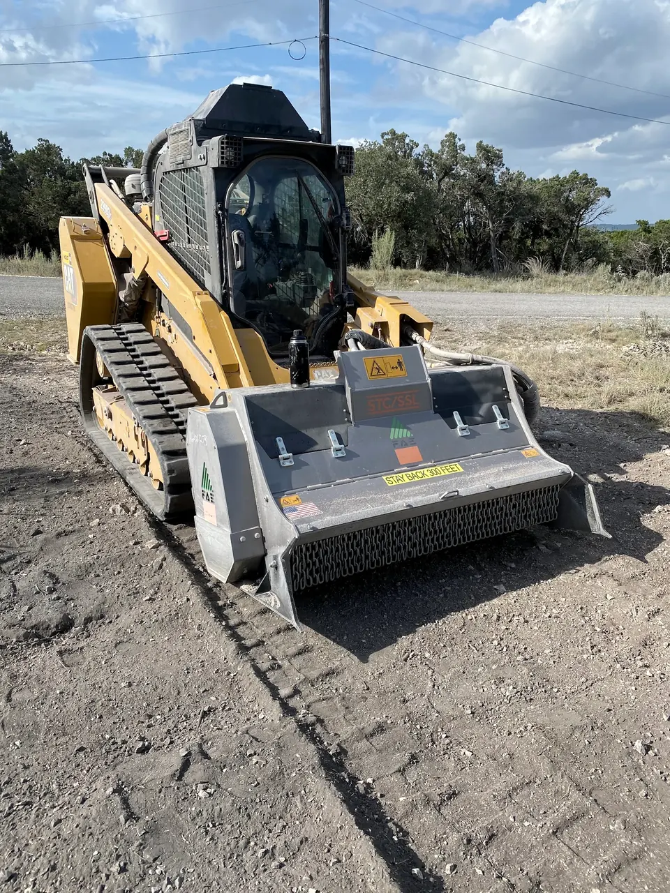 Track loader with a forestry mulching head