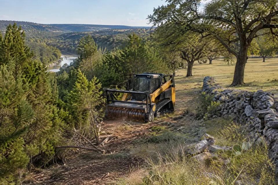 Forestry mulcher Spring Branch: track mulcher where a cedar river slope meets open live oak pasture in Spring Branch