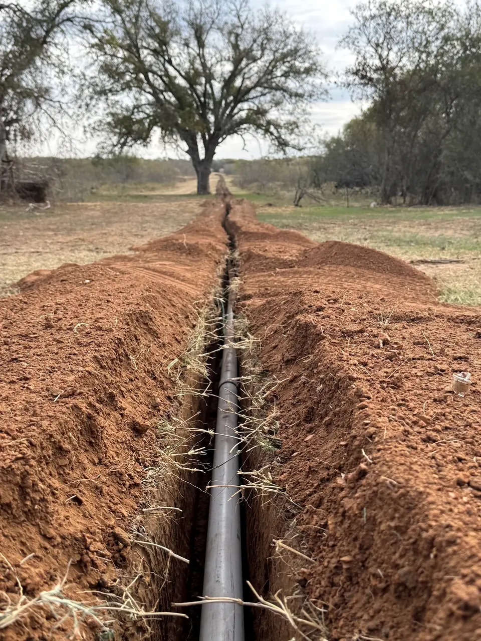 Waterline trench cut across a pasture